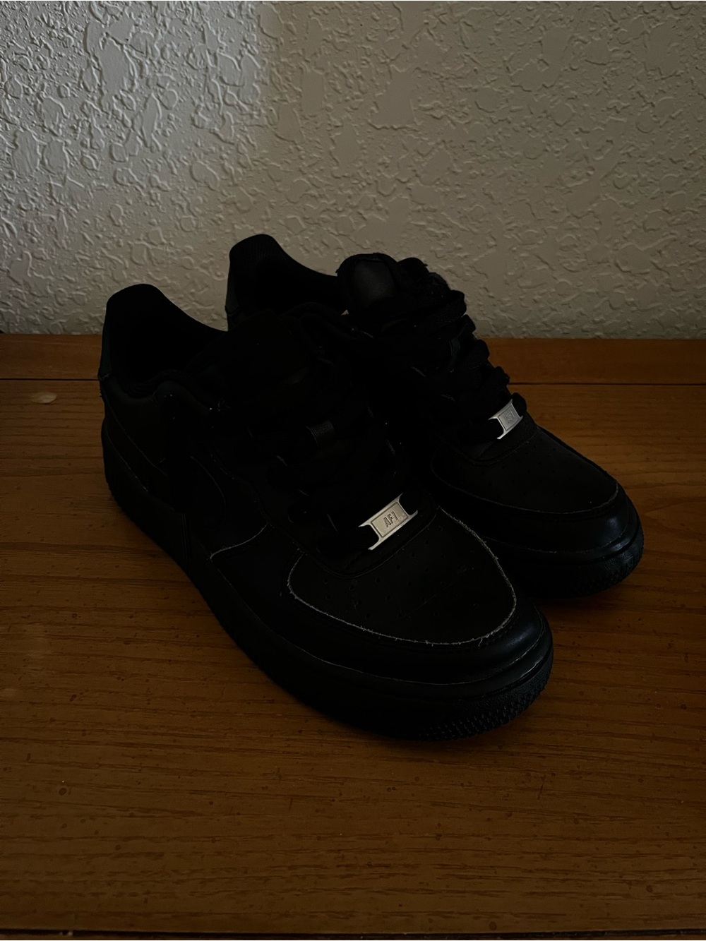 black nike air force 1s